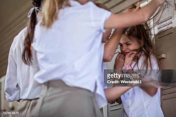 female high school students bullying classmate - persuasion imagens e fotografias de stock
