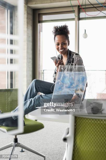 young woman working in office using transparent computer - funky office stock pictures, royalty-free photos & images
