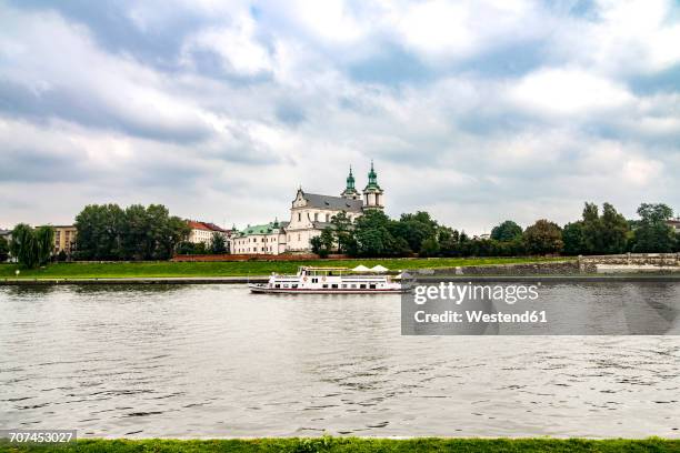 poland, krakow, pauline monastery and st. michael's church at vistula river - imbarcazione per passeggeri foto e immagini stock