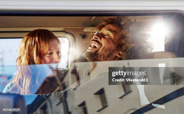 happy young couple in a car - car joy stock pictures, royalty-free photos & images