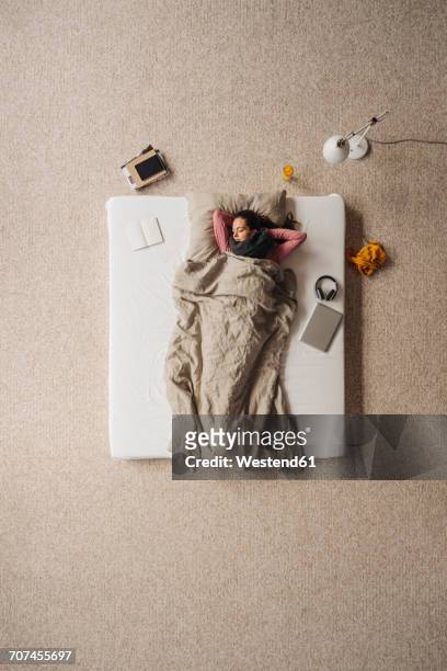 woman lying in bed, top view - mattress stock pictures, royalty-free photos & images