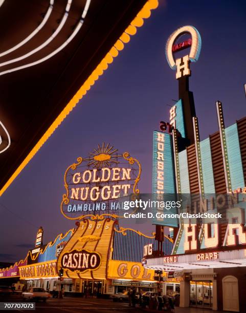 1970s NIGHT FREMONT STREET LAS VEGAS NEVADA NEON SIGNS GOLDEN NUGGET HORSESHOE CASINOS DOWNTOWN