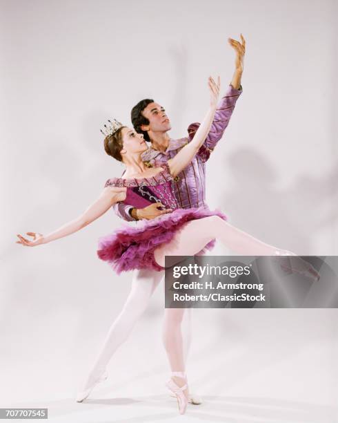 1960s 1970s MAN WOMAN COUPLE PAS DE DEUX TWO BALLET DANCERS STRIKING POSE WEARING TUTU LEOTARD