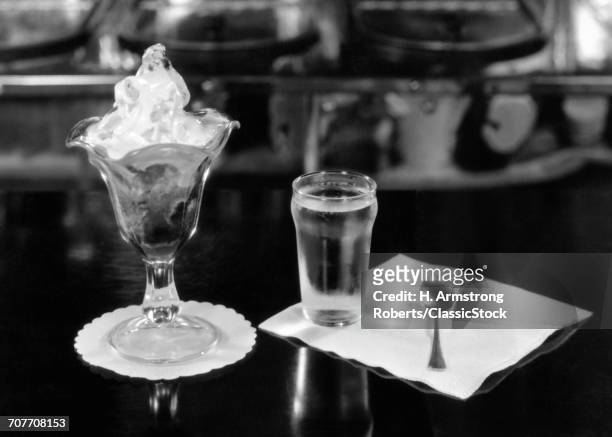1940s STILL LIFE OF ICE CREAM SUNDAE GLASS OF WATER NAPKIN SPOON ON SODA FOUNTAIN COUNTER