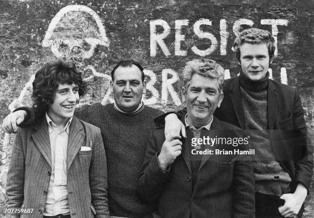 Provisional Irish Republican Army Officer in Charge of Derry Martin McGuinness and Adjutant O.C. Sean Keenan Jr. Pose with Phil O'Donnell and Sean...