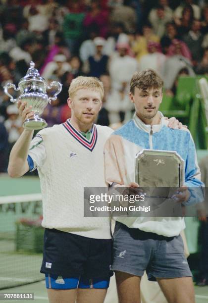 Boris Becker of Germany holds the trophy after defeating Goran Ivanisevic in the Men's Singles Final of the Mannai Cadillac Qatar Tennis Open on 11...