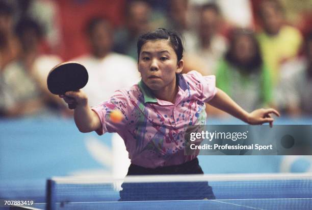 Chinese table tennis player Deng Yaping competes for China to win the gold medal in the Women's singles table tennis event at the 1992 Summer...