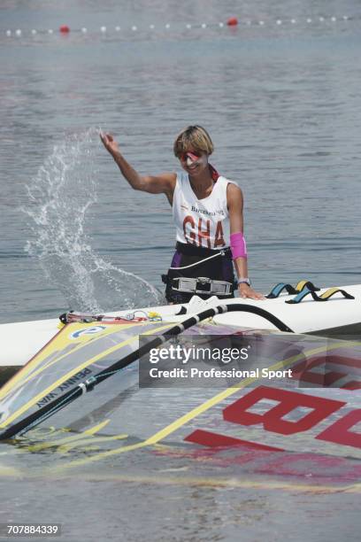 Penny Way of the Great Britain team flicks water over her sailboard during competition to finish in 6th place in the Women's Lechner A-390 sailboard...