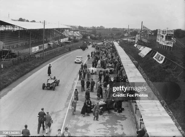 View of the pits during practice for the Ulster TT at the Ards road circuit in County Down, Northern Ireland, 3rd-4th September 1936. In the...