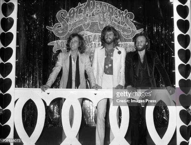 The Bee Gees attend a press event for the release of the 'Sgt. Pepper's Lonely Hearts Club Band' soundtrack album in Los Angeles, California, circa...