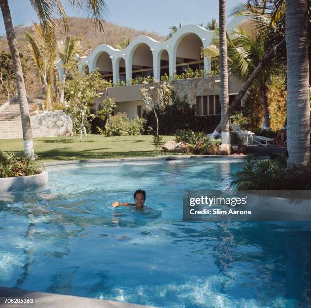 English actress Merle Oberon in a swimming pool, Acapulco, Mexico, February 1966.