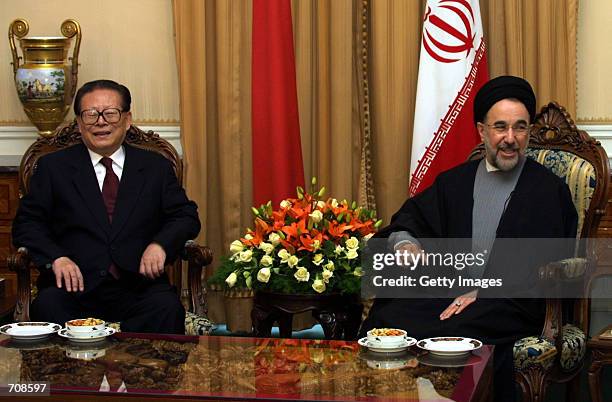 Chinese President Jiang Zemin and Iranian President Mohammad Khatami meet in Saadabad palace April 20, 2002 in Tehran. Iranian and Chinese government...