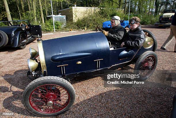 An owner of the most classic race automobile, the Bugatti, waits for the start of a rally April 21, 2002 in Ellecom, Netherlands. Each year it is...