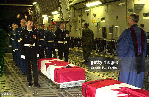 The remains of four Canadian Forces members killed supporting Operation Enduring Freedom are ceremoniously removed from a C-17 Globemaster II April...