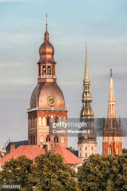 latvia, riga, church towers - riga latvia stock pictures, royalty-free photos & images