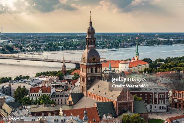 latvia, riga, cityscape with cathedral, castle and vansu bridge - oude stad stockfoto's en -beelden