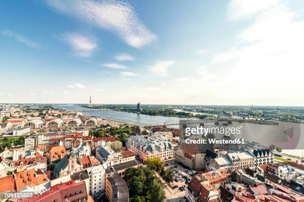 latvia, riga, cityscape with old town, and bridges over daugava river - riga stock pictures, royalty-free photos & images
