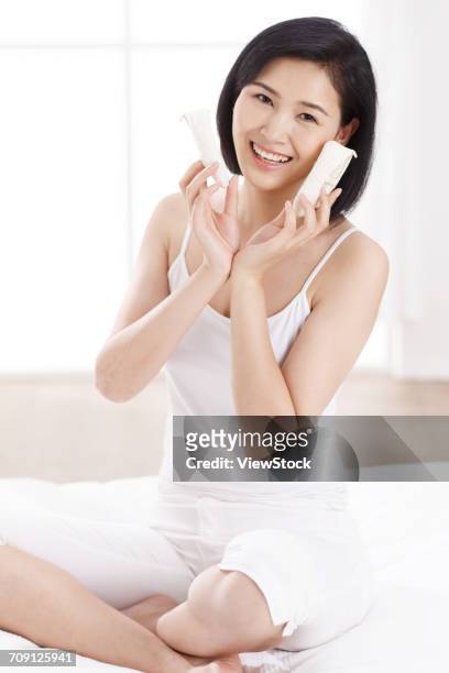 woman holding baby shoes - chinese baby shoe stock pictures, royalty-free photos & images