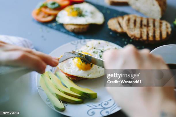 breakfast with eggs, avocado, bread and tomatoes - breakfast eggs stockfoto's en -beelden