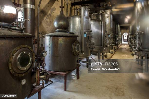 old copper boilers in old whiskey distillery - whisky distillery stock pictures, royalty-free photos & images