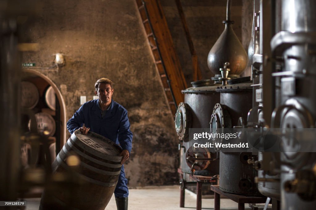 Worker working in distillery