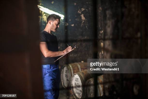 worker working in distillery - spirit 32 ストックフォトと画像