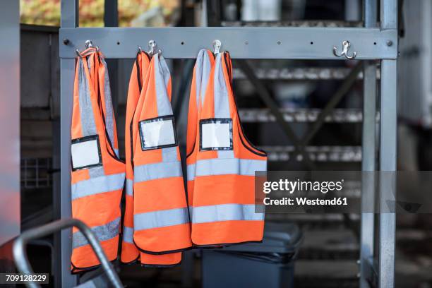 three safety vests in factory - reflexkläder bildbanksfoton och bilder