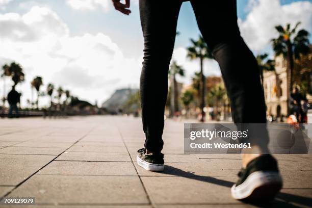 legs of a man walking on pavement - running shoes sky stock pictures, royalty-free photos & images