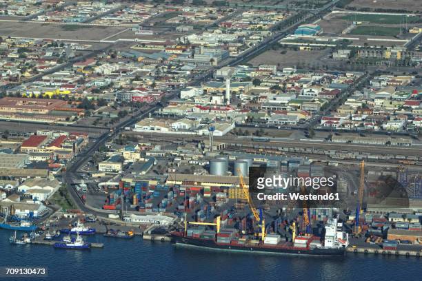 namibia, skeleton coast, walvis bay, aerial view of freight harbor - walvis bay stock-fotos und bilder