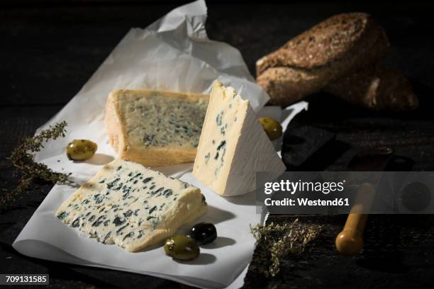 blue cheese, olives, herbs and crusty bread - blue cheese stock pictures, royalty-free photos & images