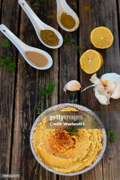 bowl of hummus and ingredients on wood - cumin bildbanksfoton och bilder