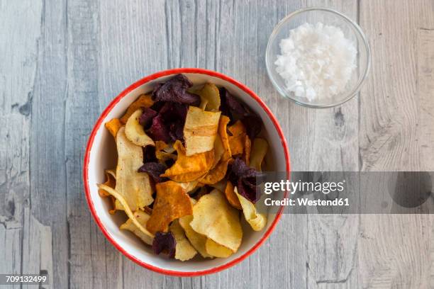 vegetable chips and pyramide salt in bowls - vegetable crisps stock pictures, royalty-free photos & images