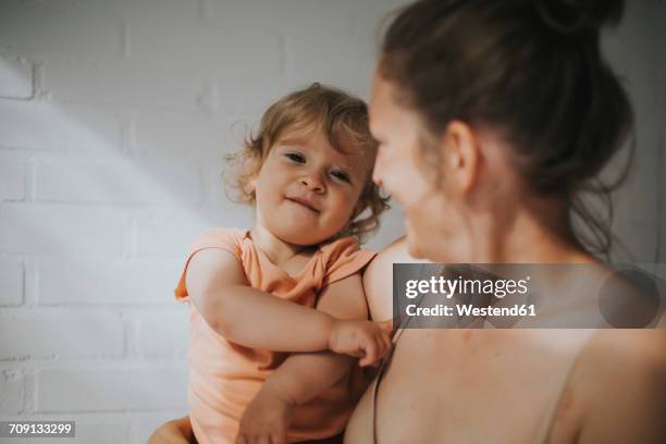 mother holding little daughter - girls in bras bildbanksfoton och bilder