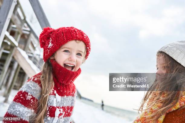 sisters having fun in winter - day 6 stock-fotos und bilder
