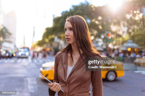 usa, new york, manhattan, young businesswoman with tablet watching something - beautiful woman shocked stock pictures, royalty-free photos & images