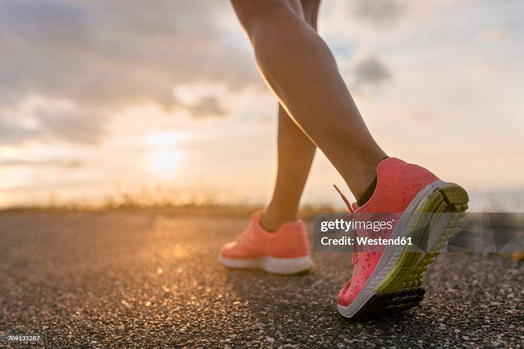 Legs of a running woman