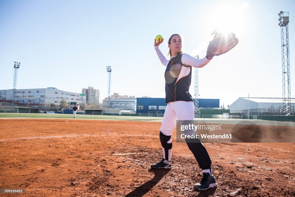 Female pitcher ready to throw the ball during a baseball game
