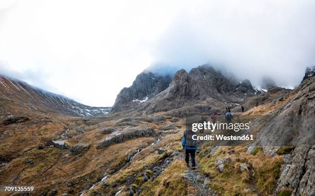 uk, scotland, trekking at ben nevis - people climbing walking mountain group stock pictures, royalty-free photos & images