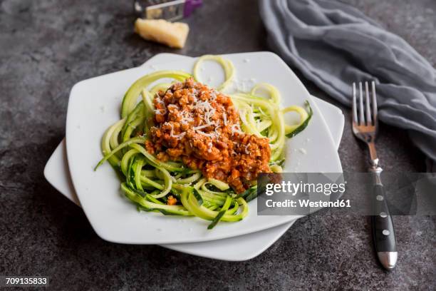 zoodles with vegetarian bolognese sauce and parmesan - bolognese sauce stock pictures, royalty-free photos & images