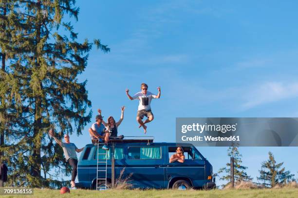 group of friends having fun at van in the nature - alternative lifestyles stock-fotos und bilder