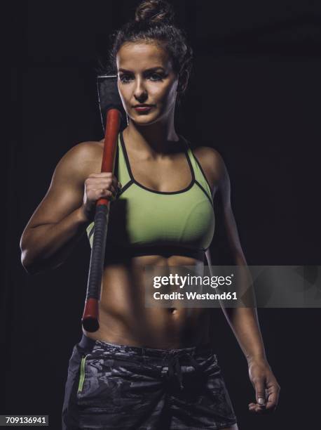 young athlete holding sledgehammer - sledge hammer stock pictures, royalty-free photos & images