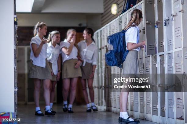 female high school students bullying classmate - bully school stock-fotos und bilder