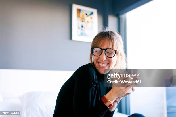 happy young woman at home drinking cup of coffee - coffee at home imagens e fotografias de stock