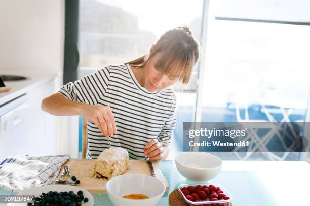 young woman preparing vegan cake - woman making cake stock pictures, royalty-free photos & images