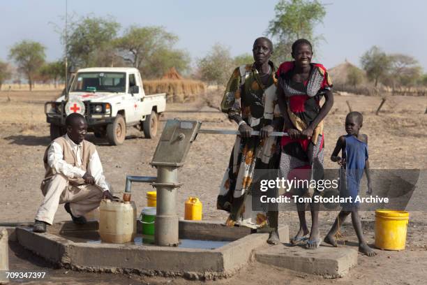 Women and children photographed collecting water at Wara village in Pariang County in Unity State, South Sudan where the International Committee of...