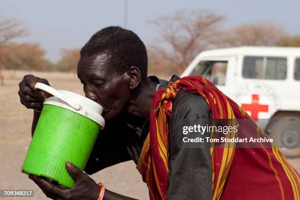 Woman photographed drinking water at Wara village in Pariang County, Unity State, South Sudan where the International Committee of the Red Cross have...