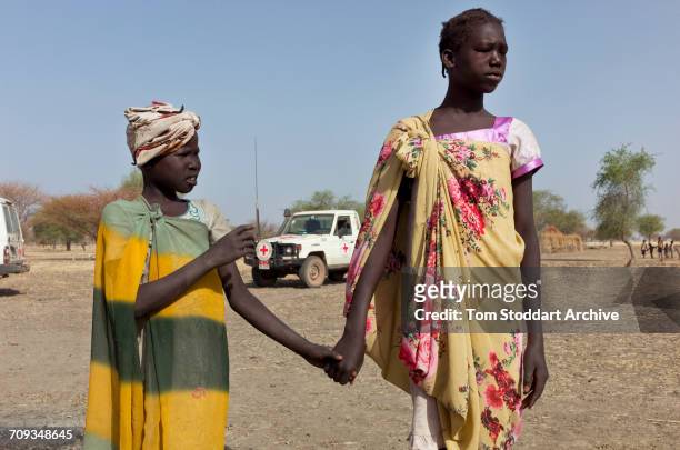 Girls hold hands as they collect water at Wara village in Pariang County in Unity State, South Sudan where the International Committee of the Red...