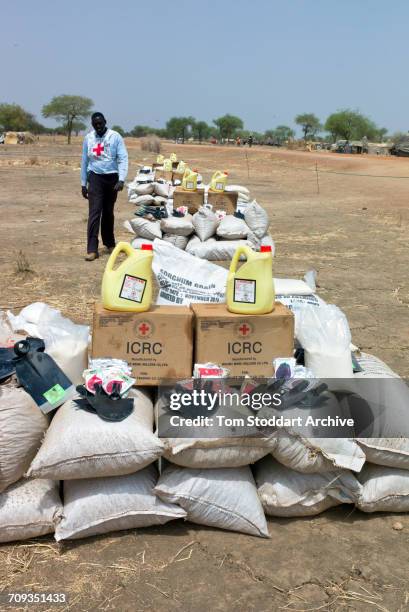 Scene in Abathok village during an International Committee of the Red Cross distribution of seeds, agricultural tools and food staples to households...