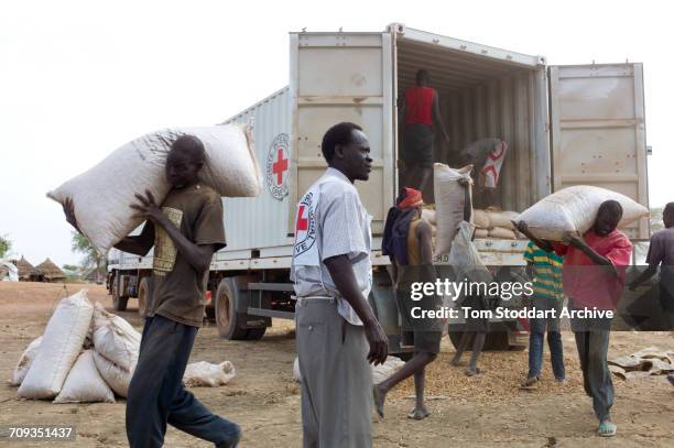 Scene in Abathok village during an International Committee of the Red Cross distribution of seeds, agricultural tools and food staples to households...