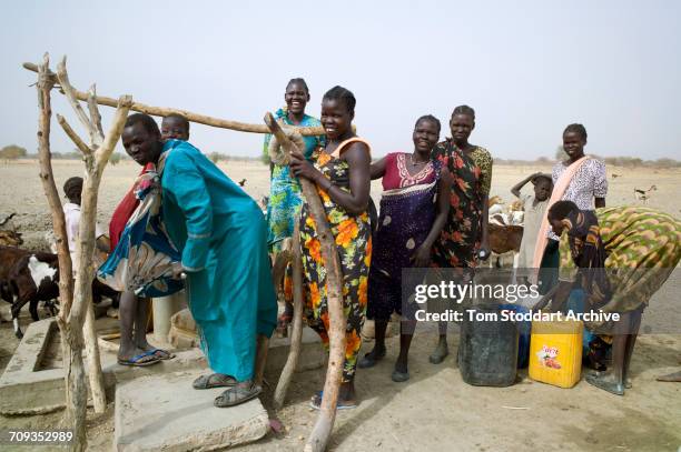 Women and children collect water at Wengoth village in Pariang County in Unity State, South Sudan where the International Committee of the Red Cross...